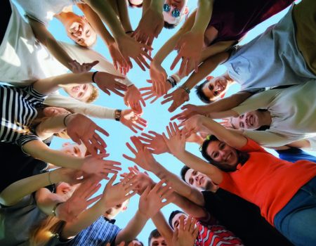 School class collection. The pupils wave their hands and run. ollege Students Teamwork Stacking Hand Concept. Nineteen friends
