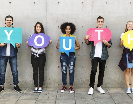 Group of young adults outdoors holding empty placard copyspace thought bubbles